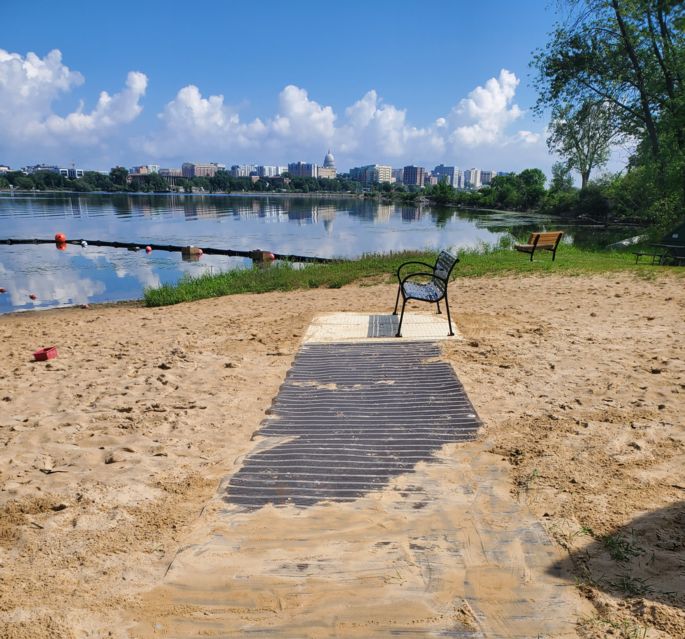 beach with mat and bench 