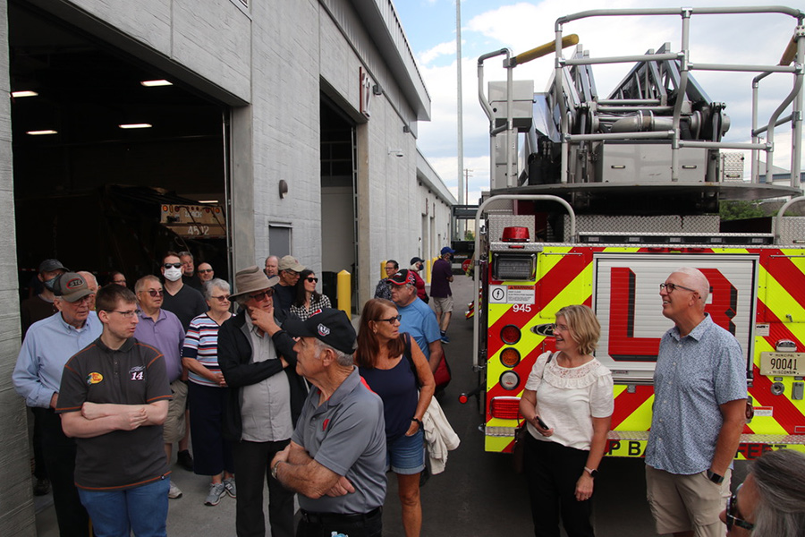 Attendees tour the building and look at Fire Ladder 8
