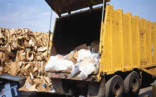 Loaded truck dumping at recycling center