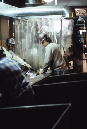 Workers at Waste Management's Madison Recycling Center sorting recycling