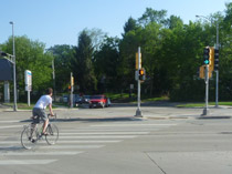 Bicyclist using Ridge Street signal